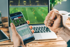 shutterstock 1570645063 9 300x200 - Man,Watching,Football,Play,Online,Broadcast,On,His,Laptop,,Cheering